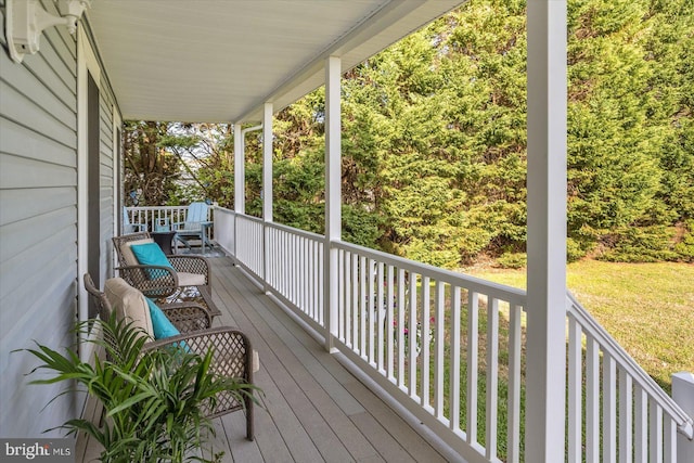 wooden terrace with a porch