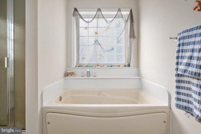 bathroom featuring a whirlpool tub
