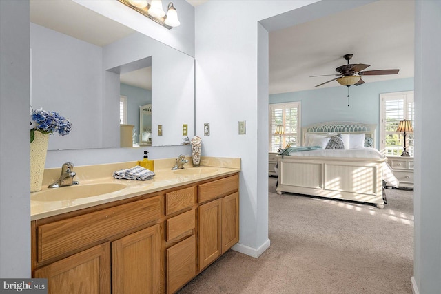 full bathroom with a sink, a ceiling fan, and a wealth of natural light
