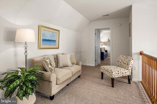 living area featuring baseboards, visible vents, light carpet, and vaulted ceiling