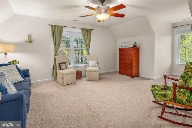 sitting room featuring baseboards, carpet, a ceiling fan, and lofted ceiling