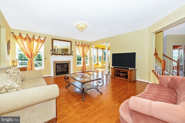 9743 Wyndham Dr, Frederick, MD 21704 - living room featuring light wood-style flooring, plenty of natural light, and a fireplace with flush hearth