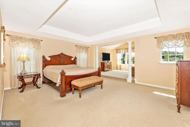 9743 Wyndham Dr, Frederick, MD 21704 - carpeted bedroom featuring ornate columns, a tray ceiling, baseboards, and ornamental molding
