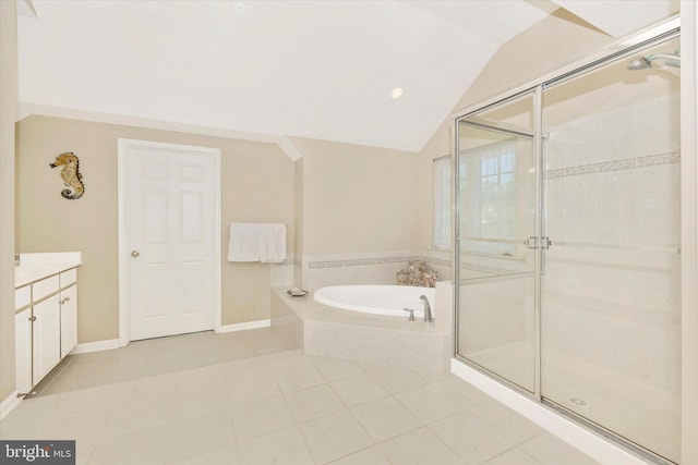 9743 Wyndham Dr, Frederick, MD 21704 - bathroom with a shower stall, a bath, vaulted ceiling, vanity, and tile patterned floors
