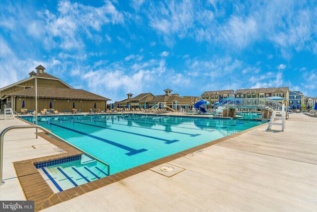 9743 Wyndham Dr, Frederick, MD 21704 - community pool with a patio and a residential view