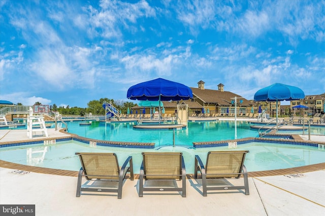 9743 Wyndham Dr, Frederick, MD 21704 - community pool featuring a water slide and a patio