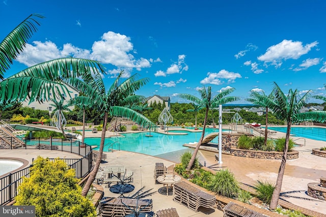 9743 Wyndham Dr, Frederick, MD 21704 - community pool featuring a patio