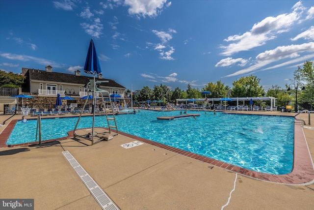9743 Wyndham Dr, Frederick, MD 21704 - community pool with a patio area and fence