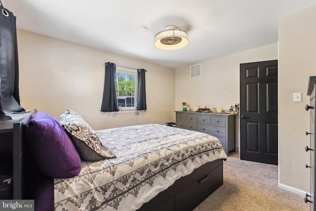 bedroom featuring visible vents, carpet flooring, and baseboards