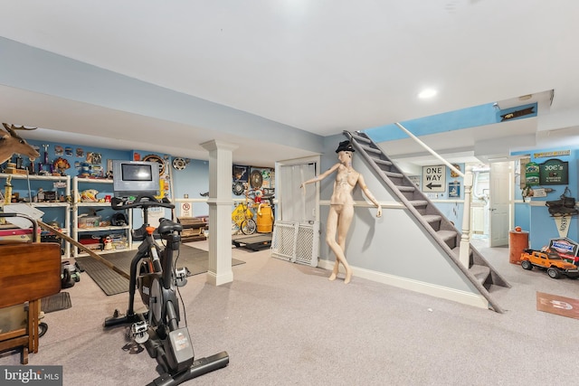 workout area featuring baseboards