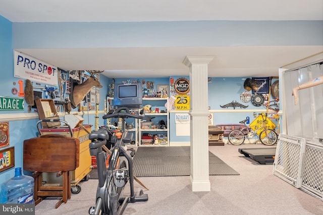 workout room with carpet floors and ornate columns