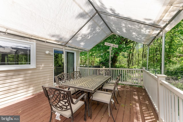 wooden deck with outdoor dining area