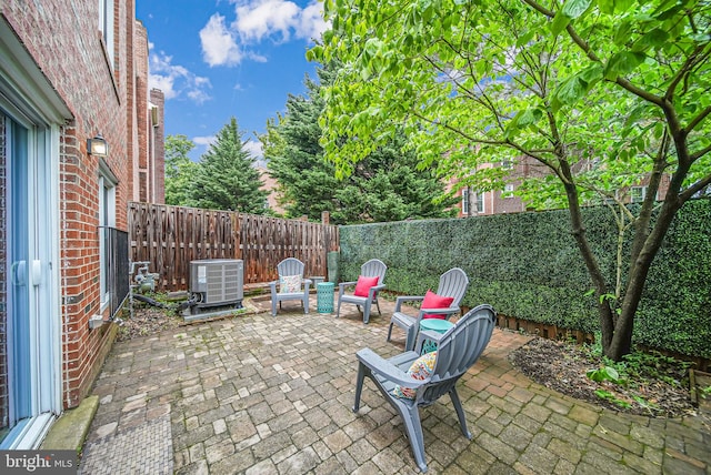 2 S Manchester St S, Arlington, VA 22204 - fenced backyard featuring central AC unit and a patio area