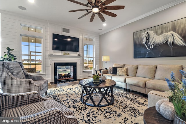 404 Wiggins Mill Rd, Townsend, DE 19734 - living room featuring a multi sided fireplace, a ceiling fan, crown molding, wood finished floors, and recessed lighting