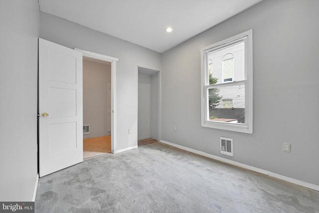 unfurnished bedroom featuring baseboards and visible vents