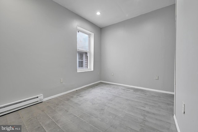 spare room featuring baseboards, a baseboard radiator, and recessed lighting