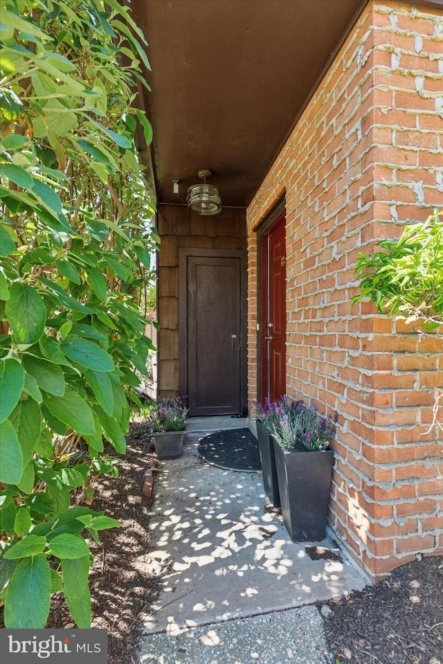 property entrance with brick siding