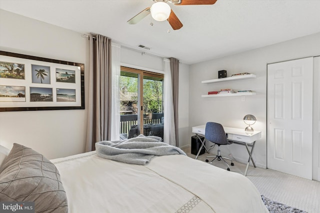 carpeted bedroom featuring access to outside, ceiling fan, and visible vents