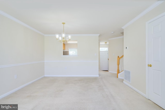 spare room with crown molding, visible vents, light colored carpet, and a chandelier