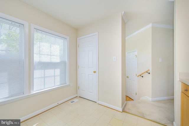 unfurnished bedroom with baseboards, light floors, and visible vents