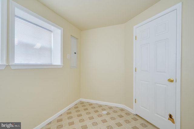 spare room featuring baseboards
