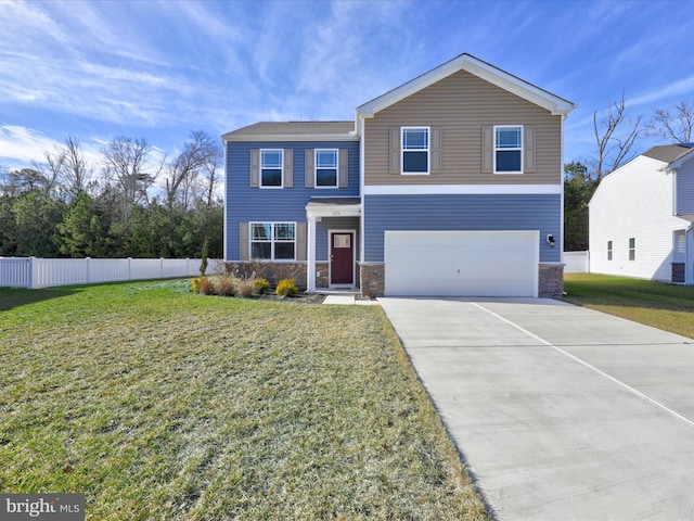 traditional-style house with fence, a front lawn, concrete driveway, an attached garage, and stone siding