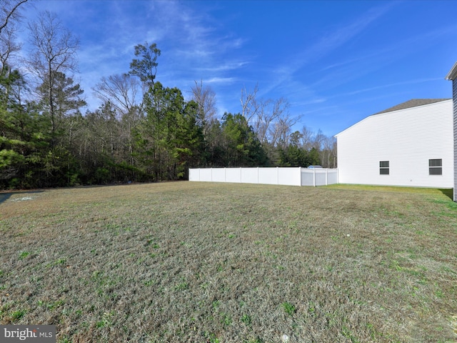view of yard with fence