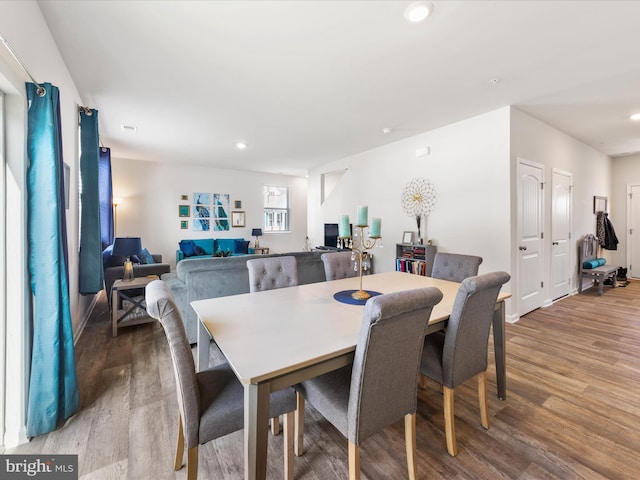 dining room featuring recessed lighting and wood finished floors