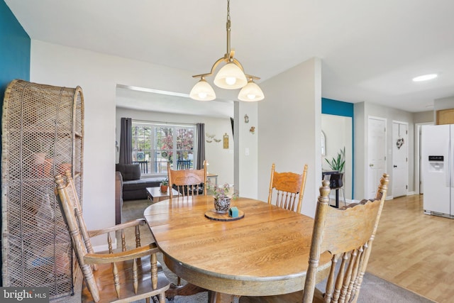 dining area featuring light wood-type flooring