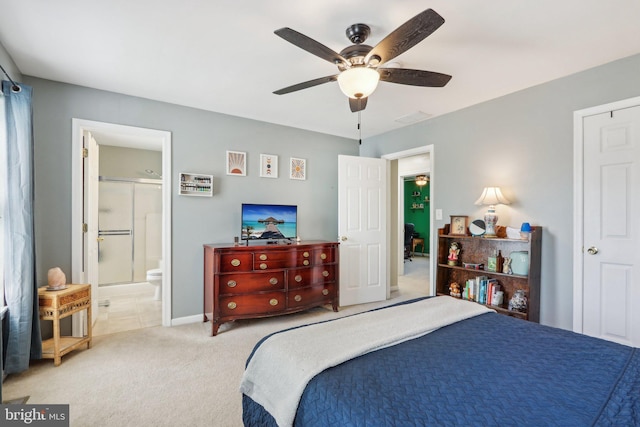 bedroom with visible vents, baseboards, ceiling fan, ensuite bath, and light carpet