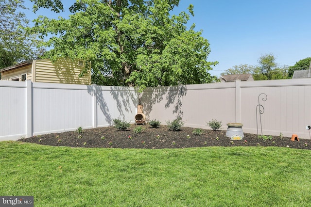 view of yard with a fenced backyard