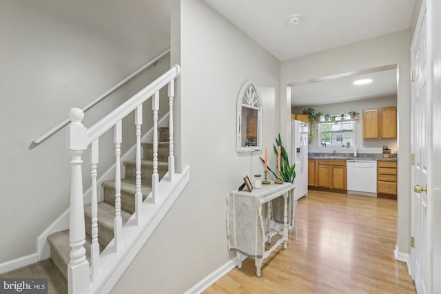 interior space featuring baseboards and wood finished floors