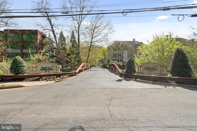 view of road with curbs