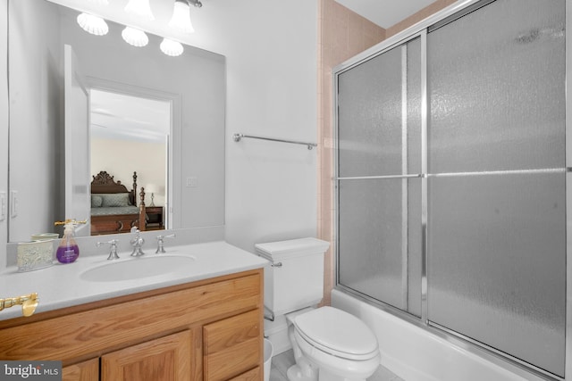 full bath with vanity, ensuite bathroom, enclosed tub / shower combo, and toilet