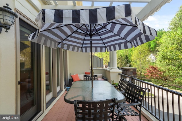 wooden deck with outdoor dining area