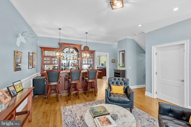 bar with recessed lighting, baseboards, bar, and light wood-style flooring