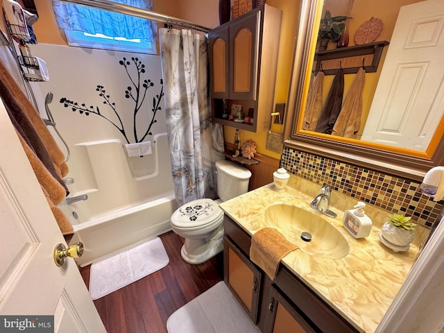 bathroom with decorative backsplash, wood finished floors, vanity, toilet, and shower / bathtub combination with curtain