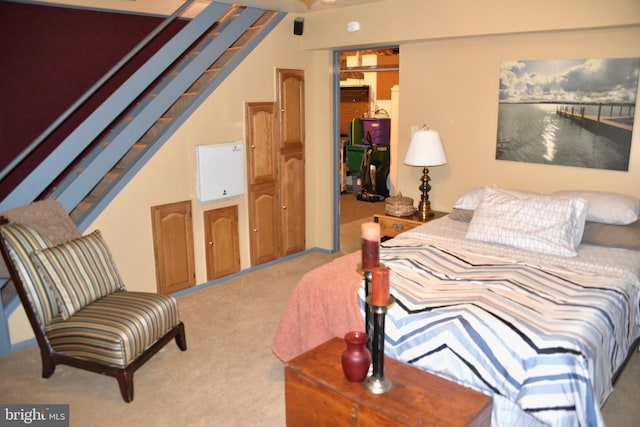 carpeted bedroom featuring vaulted ceiling