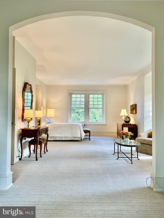 carpeted bedroom featuring baseboards