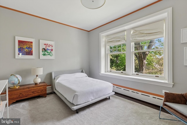 bedroom featuring crown molding, carpet floors, and baseboard heating