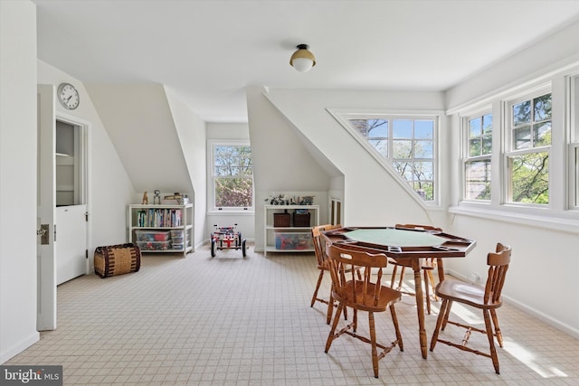 game room featuring carpet floors, baseboards, and vaulted ceiling