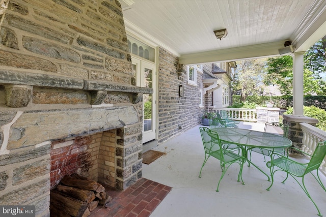 view of patio / terrace featuring covered porch and outdoor dining area