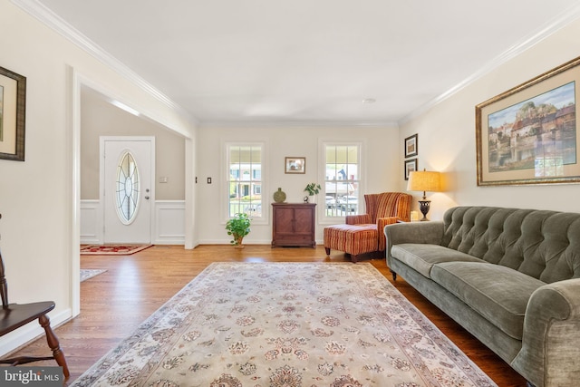 living room featuring crown molding and wood finished floors