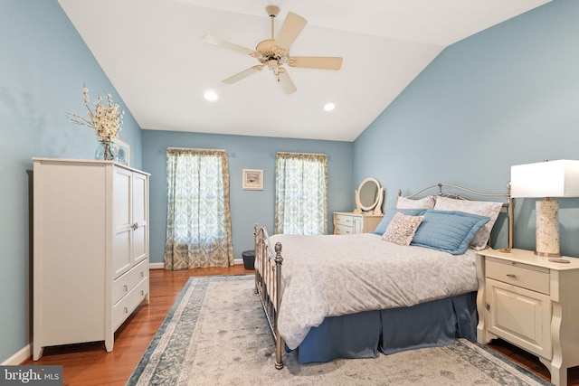 bedroom with recessed lighting, baseboards, a ceiling fan, wood finished floors, and lofted ceiling