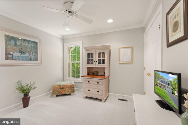 carpeted home office featuring ceiling fan, recessed lighting, baseboards, visible vents, and ornamental molding