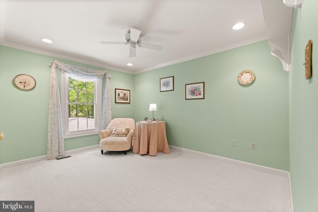 sitting room featuring ceiling fan, crown molding, baseboards, carpet flooring, and recessed lighting