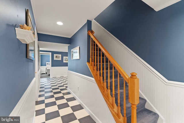 stairs with recessed lighting, tile patterned floors, a wainscoted wall, and ornamental molding