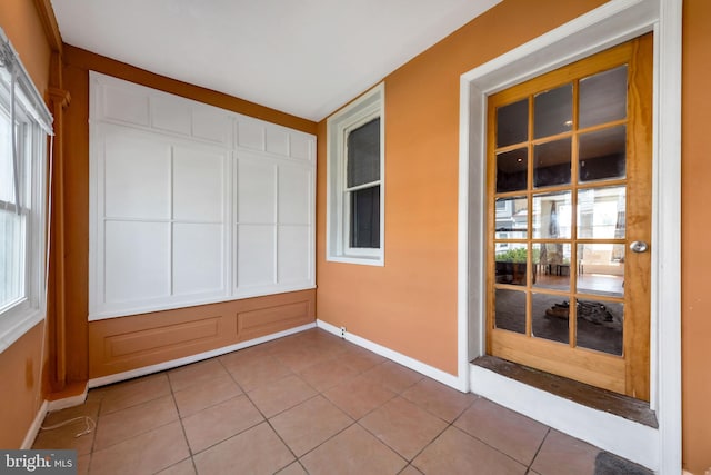 unfurnished sunroom featuring a healthy amount of sunlight