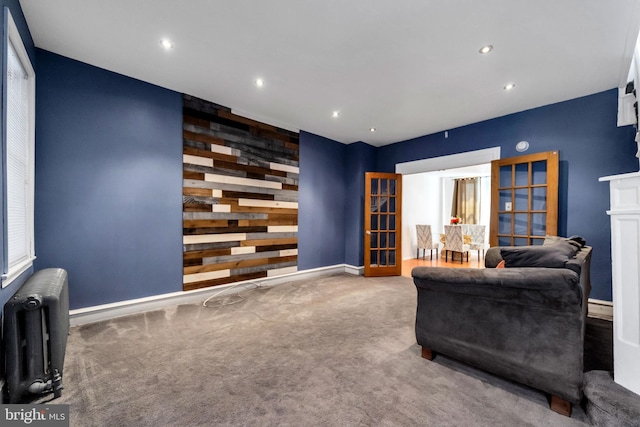 interior space featuring recessed lighting, carpet flooring, radiator, and baseboards