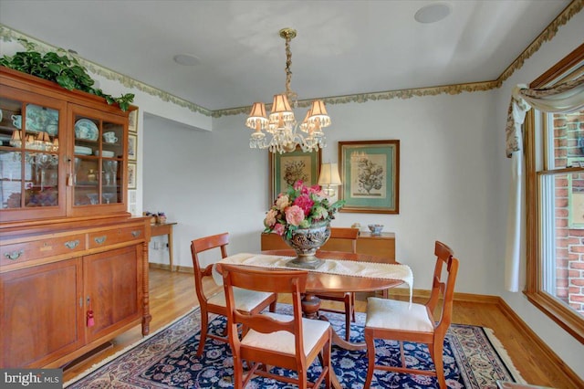 8 Roger Ave, Shippensburg, PA 17257 - dining space with light wood-style floors, a chandelier, and baseboards